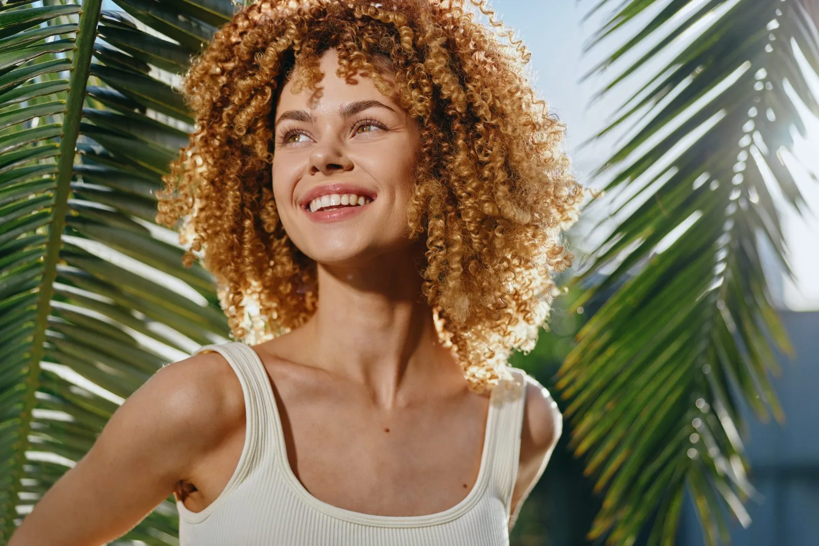 Smiling woman with curly hair – online psychiatry in Springfield, OR